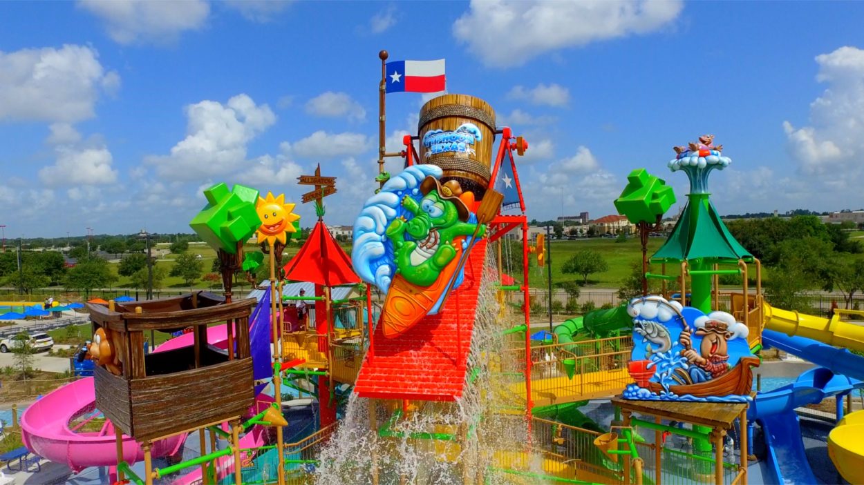 a large water park with slides and splash waters