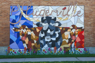 a mural on the side of a brick building